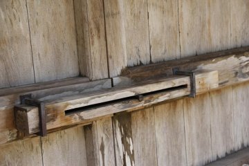 The actual door at the gate is made of wood
