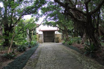 <p>The pathway leading to the Seimon main gate are paved with limestone and edged by stone culverts</p>