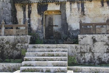 <p>The steps and door leading to the center room in which bones of the deceased were cleaned</p>