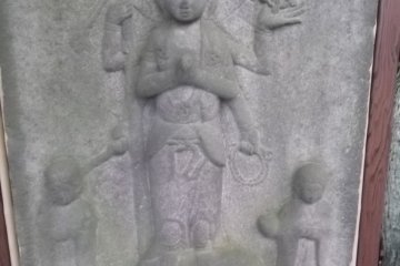 An unusual relief carving, weatherworn but interesting