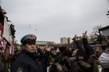 A large police presence is around to ensure order and minimal injuries to the temple-goers.