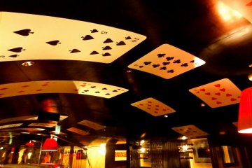 Celings are adorned with a procession of playing cards