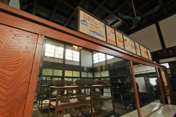 The changing room of the bath house, complete with classic ads of the local stores