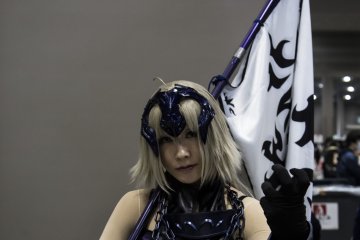 Cosplayers pose all day for photographers