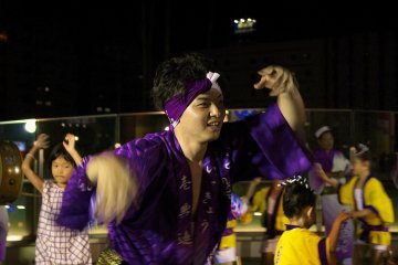 Adults and children dancing together