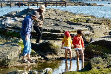 Kids are playing around on a rocky stretch