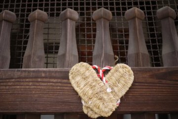 The sandals of pilgrims hang on the front gate