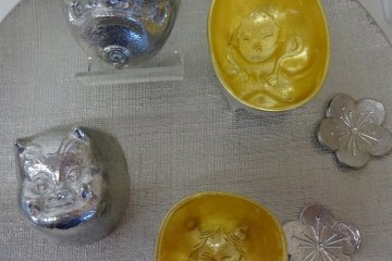 Beautiful metal cast sake cups made by one of Takaoka's metal cast workshops