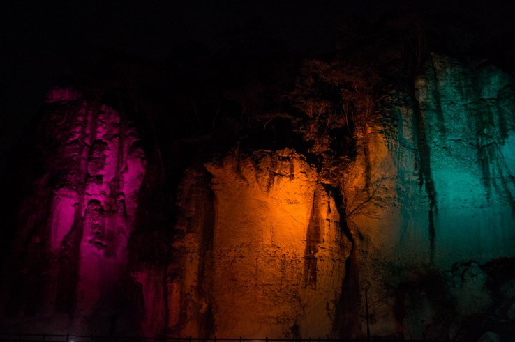 Multi-coloured lights illuminate the cavern, giving it a magical atmosphere