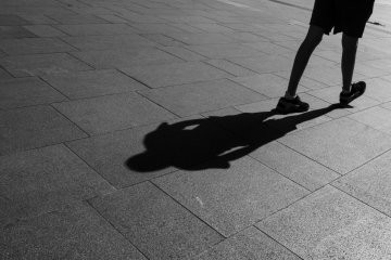 On any street, you will see shadows when the sunlight is harsh, so wait for the right moment and take your dramatic picture