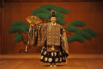 Traditional performance art featuring impressive costumes. 