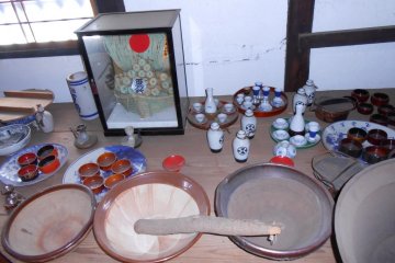 Beautiful sake cups and bowls and mortar to grind sesame seeds in the front