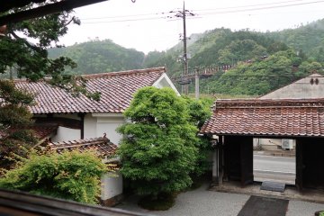A view from the second floor. The small valley above the left rice granary is a chair-lift up to the castle