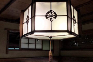 The hollyhock emblem is incorporated into fixture space and woodwork