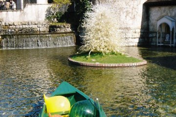 Pond, glass art, and the main building