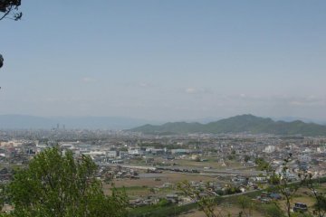 Mt. Kinka off to the right, two skyscrapers in downtown Gifu City off to the left, and the mountain range of Shiga Prefecture in the distance.