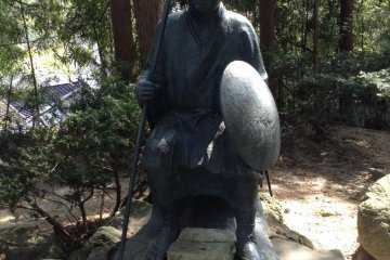 The famous Japanese haiku poet Basho visited Yamadera. He is remembered by this figure and a poem he wrote about his experience at the mountain temple.