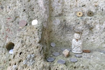 With all the energy you have while going down, make sure to explore anything you may have missed on the way up. Of particular interest is an area where travelers leave coins balanced precariously off and in rocks.