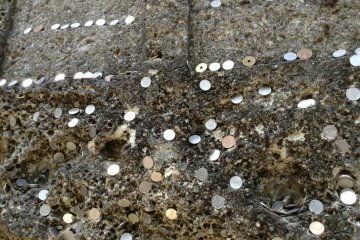 There are so many coins sticking out of the rocks. It should go without saying: please leave them in their place!