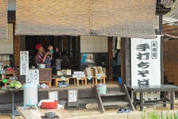 Smiling shopkeepers.