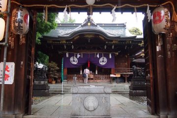 Moment of peace in the busy shrine. The building inside is the main one.