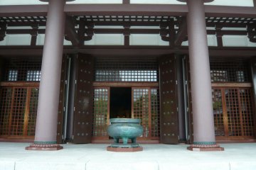 An incense burner stands in front of the entrance to Tocho-ji