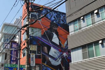 The street art on the side of the building is hard to miss