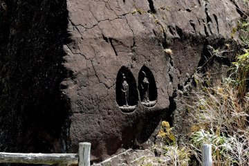 Buddhist statues carved into a large rock