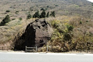 Rock with Buddhist statues