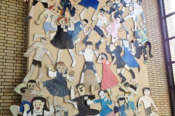 Wall of self portraits by local children in the foyer