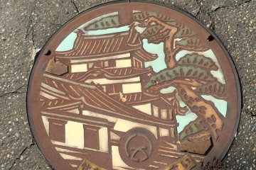 Wild plants add some wabi sabi to Sekiyado manhole covers