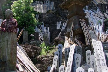 "Toba" prayer boards climb the hill to the left of the temple