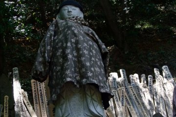 This stature looks down on the temple grounds from high up on a hill