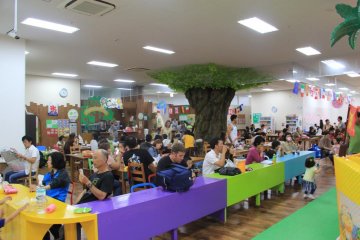 <p>There are dozens of tables and benches for parents and children to rest or enjoy a snack at</p>