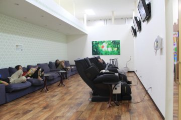 <p>The relaxation room features sofas, television, an internet terminal and massage chairs</p>