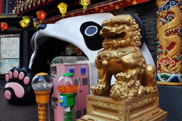 The entrance to a shopping mall is a panda's mouth