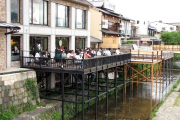 Wooden decking above the Kamo River at this Sanjo Ohashi coffeeshop
