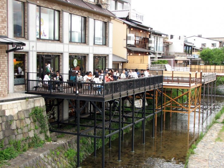 Wooden decking above the Kamo River at this Sanjo Ohashi coffeeshop