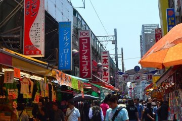 Stalls and shops lining the tiny alley.