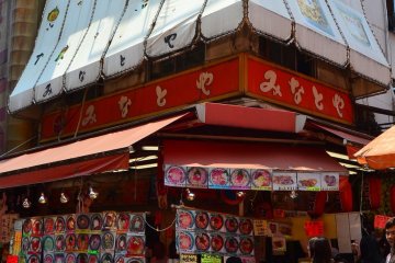 Delicious food stalls on a street corner.