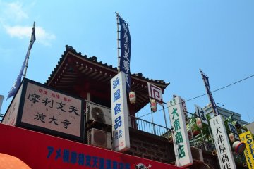 Temple at the top of shop building.