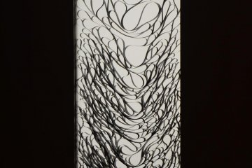 Chaotic sounds tape that descends from above.