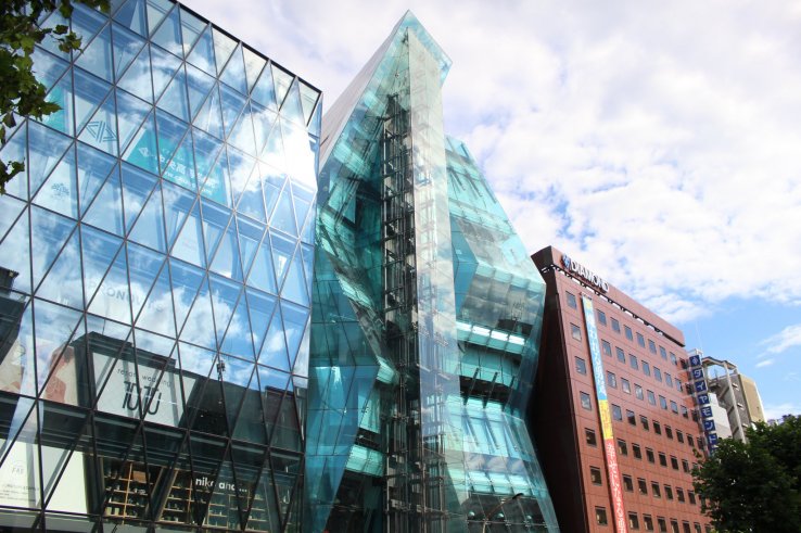 WeWork Iceberg: an asymmetric glass façade with external elevator shaft