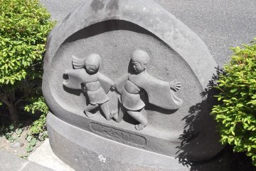 Dosojin (roadside guardian deities) near the station