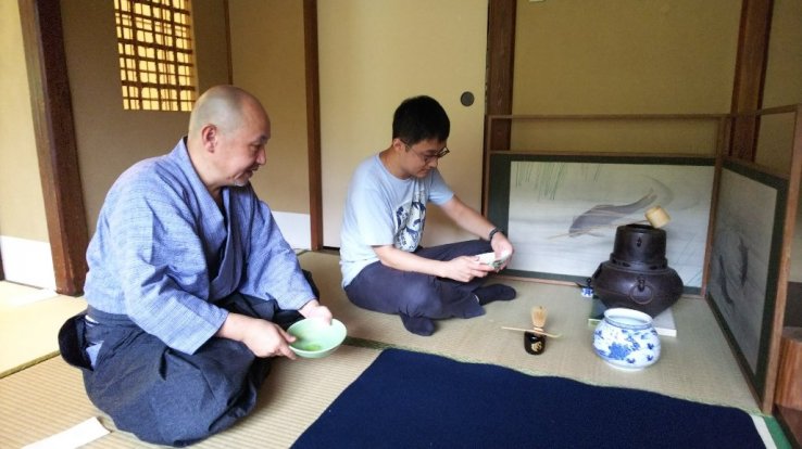 Performing a tea ceremony with guests