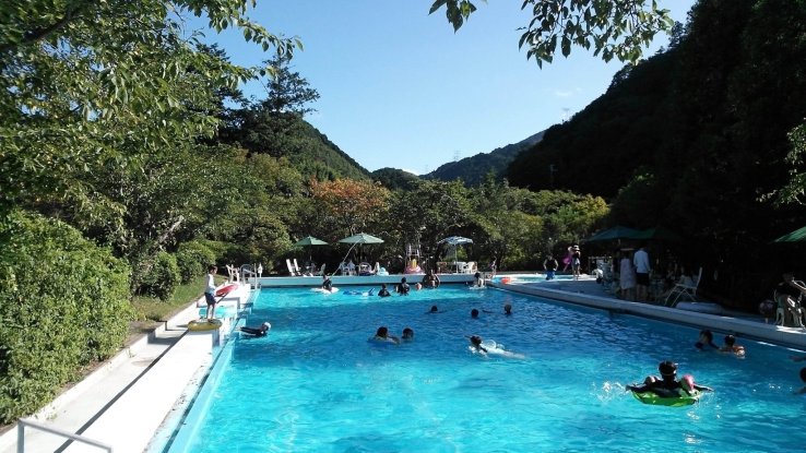 Outdoor pool surrounded by hills.