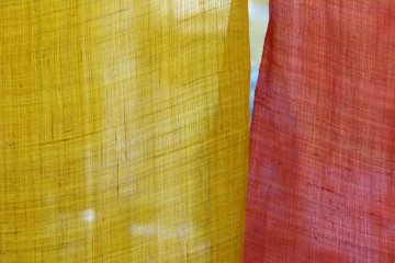 colorful noren curtain in front of the kitchen