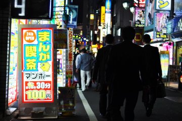 Crowds of people moving through the streets
