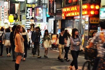 This lady was standing on the street trying to find potential customers for a hostess club