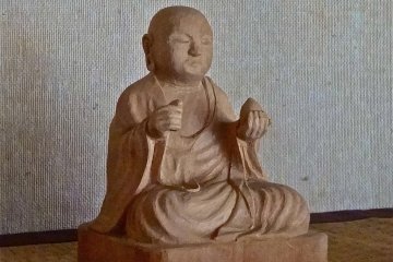 This wooden statue is another artwork that the shop can provide upon request